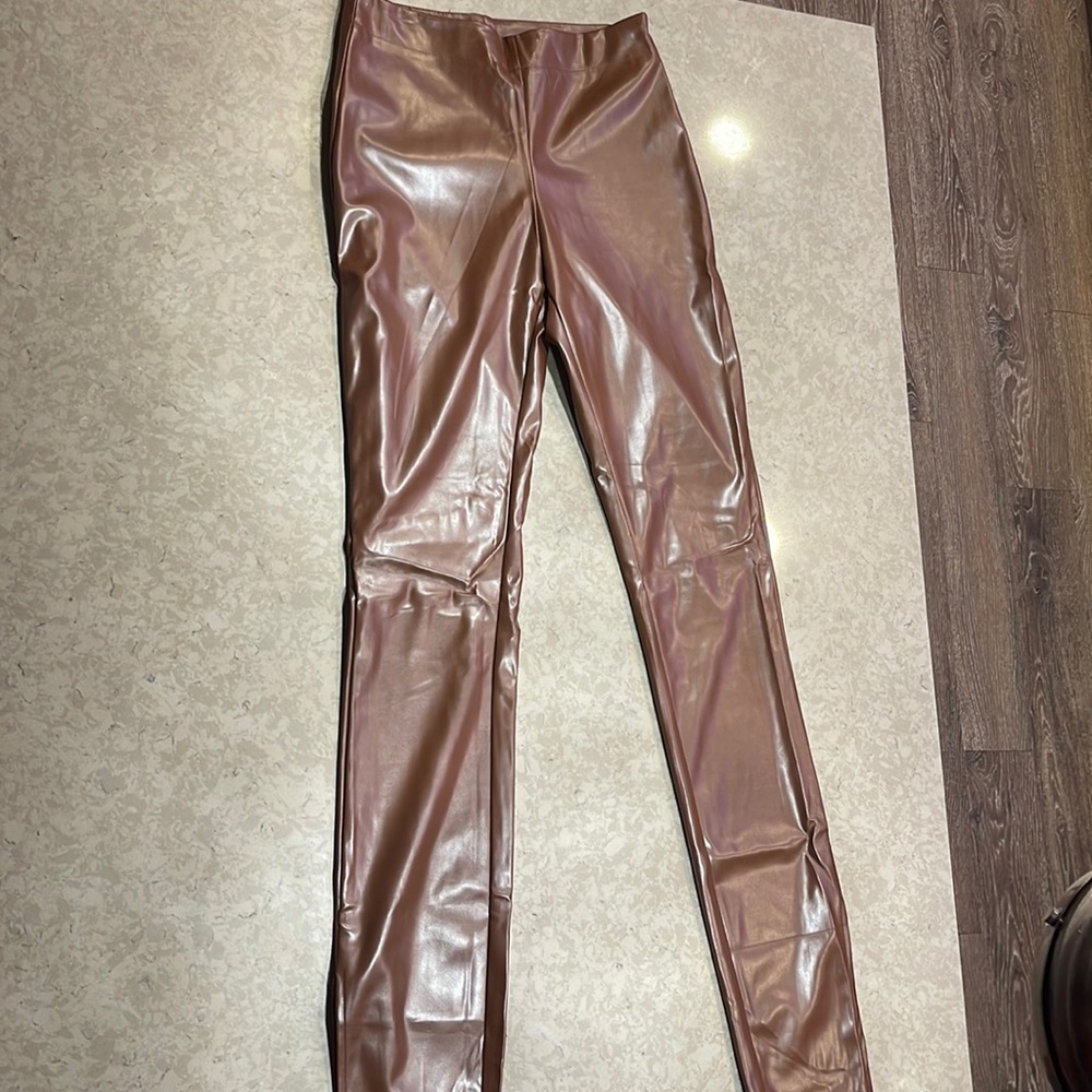 Brown leather pants.